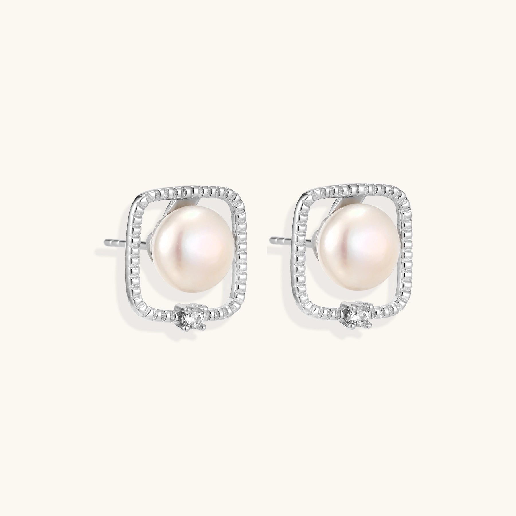 Square sterling silver stud earrings with freshwater pearls and crystal accents on white background.