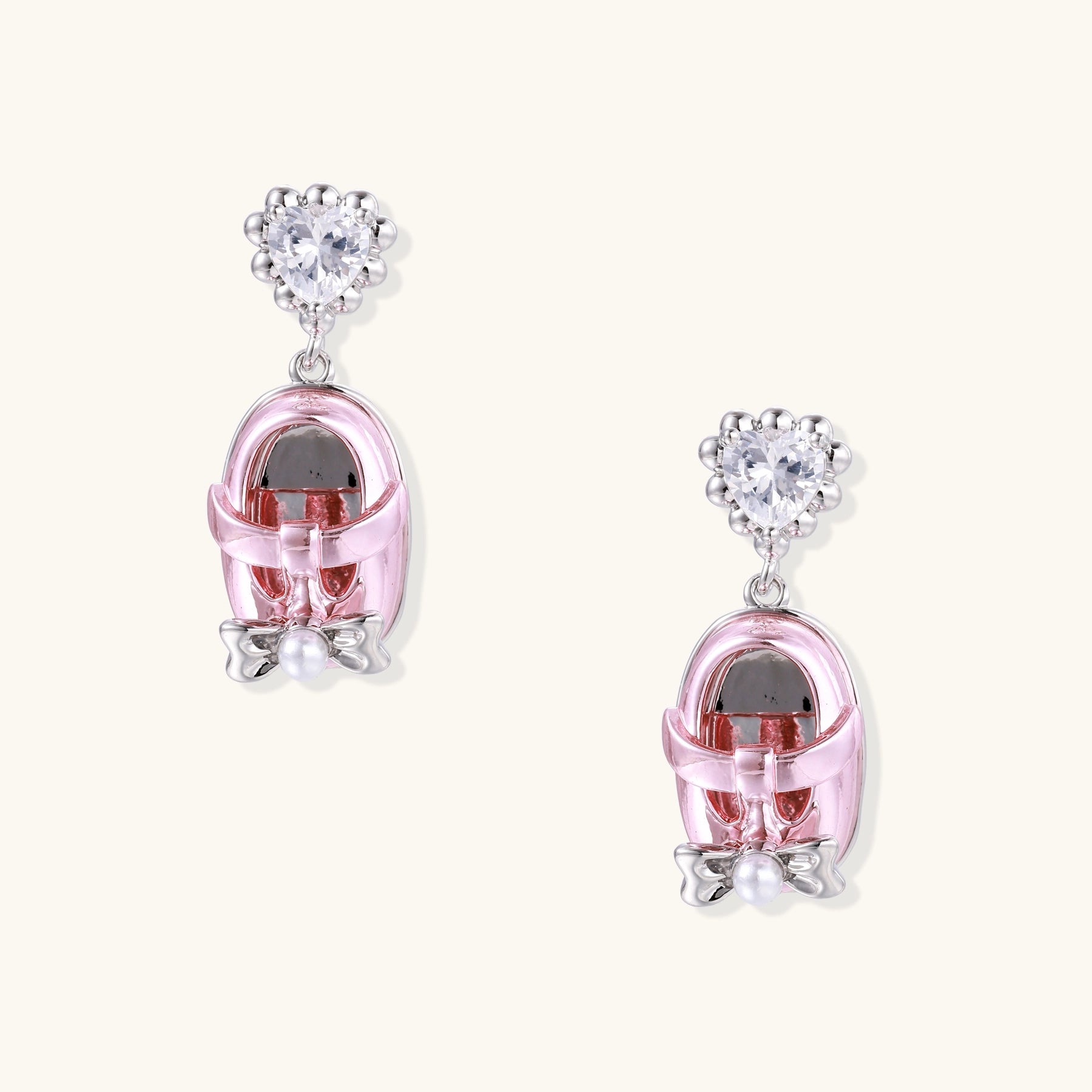 18K gold plated drop earrings with heart-shaped zirconia studs and translucent mini handbag pendants with pearl accents