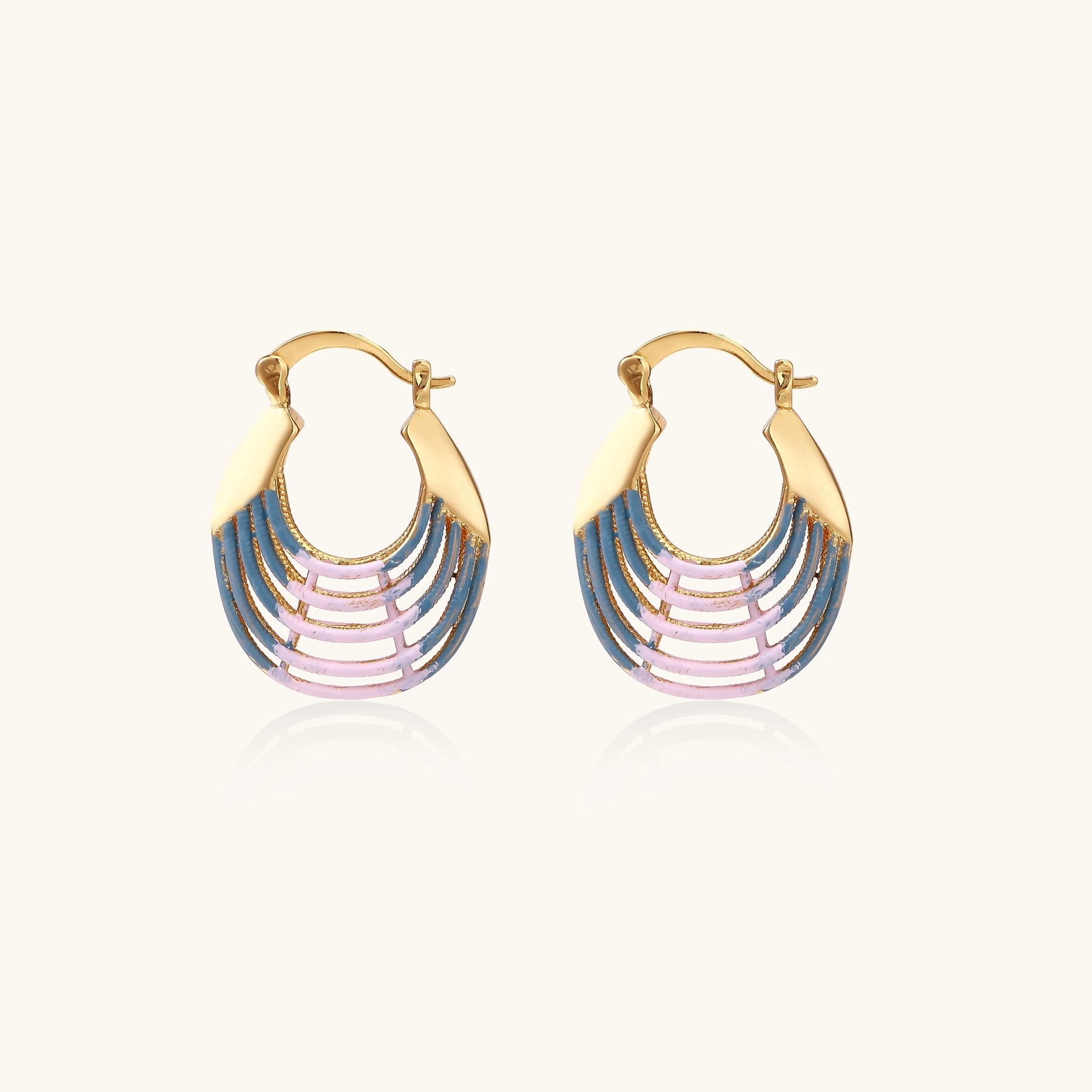 Gold hoop earrings with layered blue to pink enamel in shell pattern, photographed against white background