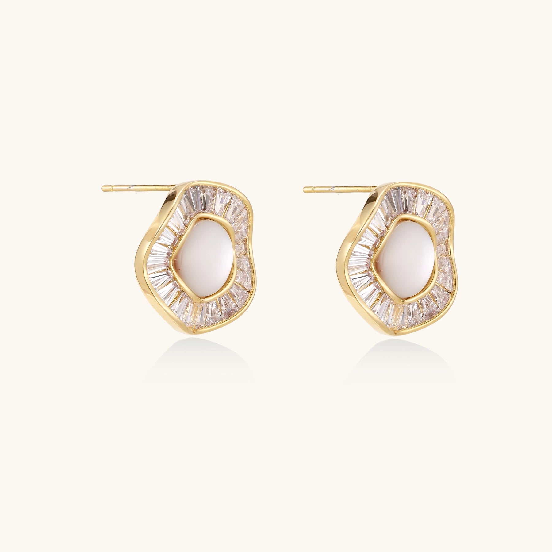 Gold-plated stud earrings with central freshwater pearl surrounded by baguette crystals in radial pattern