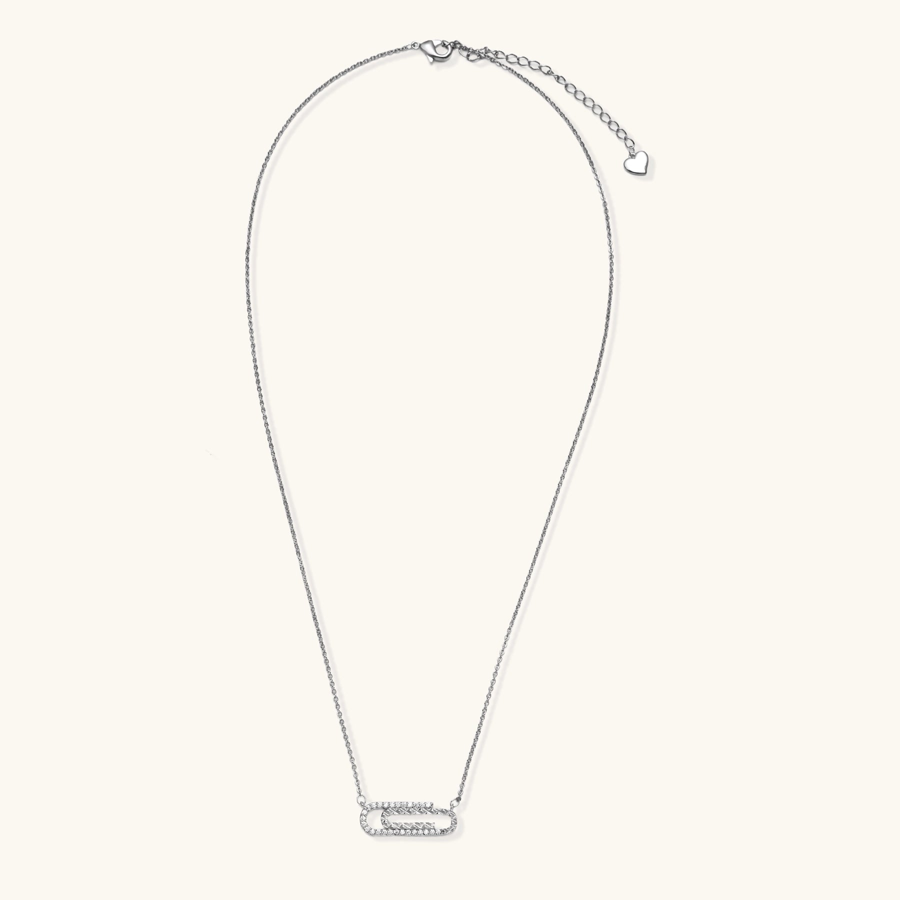 Delicate 14K gold plated chain necklace with crystal-accented carabiner-style pendant on white background